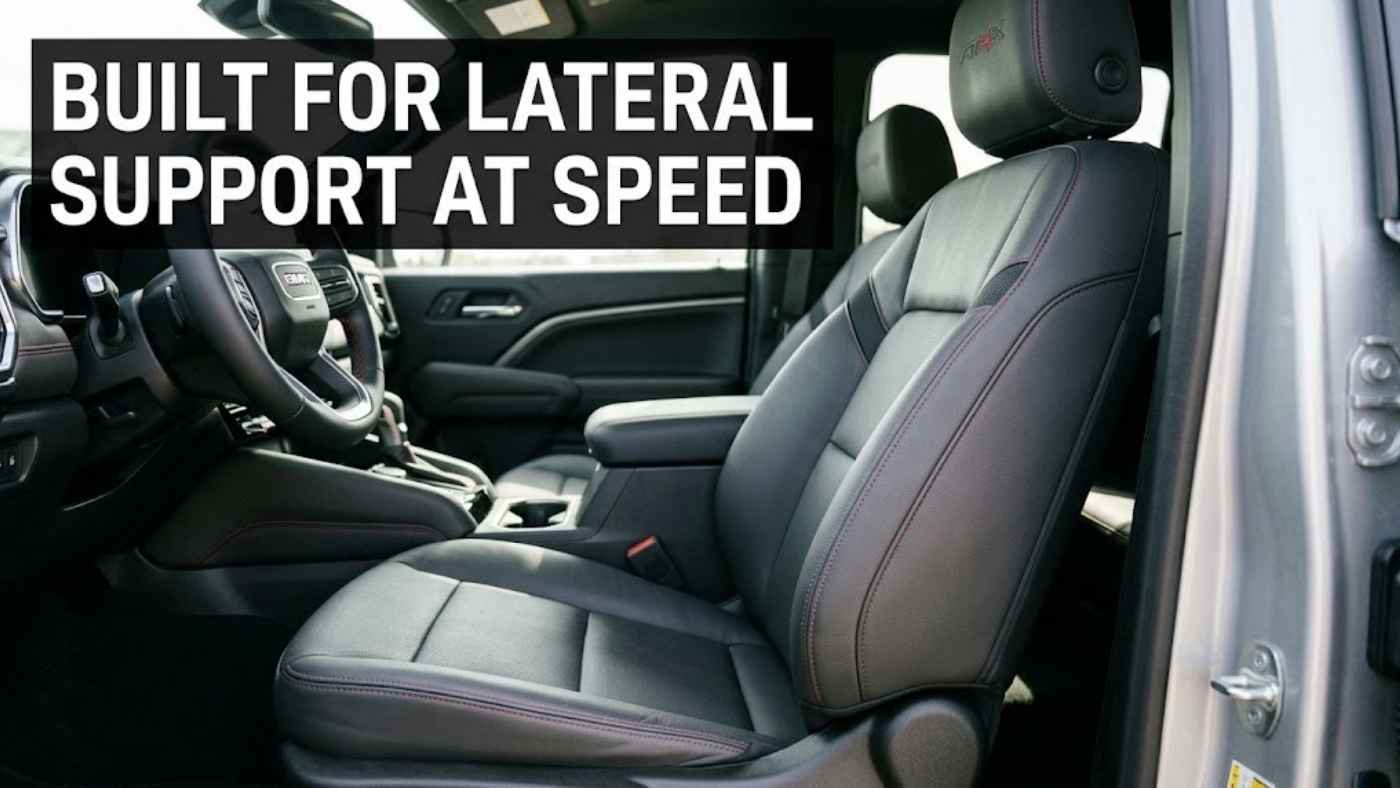 Enhanced-bolster front seat of a 2027 GMC Sierra 1500 AT4X showing quilting and double-needle stitching