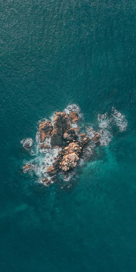 Rocky Island In Deep Blue Sea 2K iPhone Phone Wallpaper