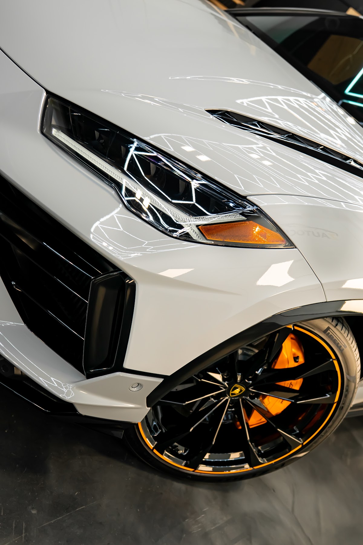 White Lamborghini Urus front three-quarter at ZAutoCare