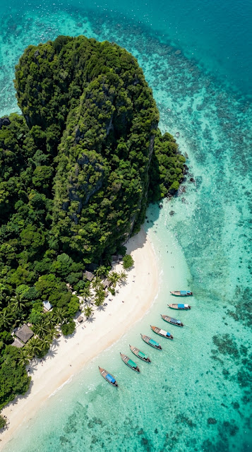 Aerial View of Tropical Beach with Limestone Karsts - Free mobile Wallpaper
