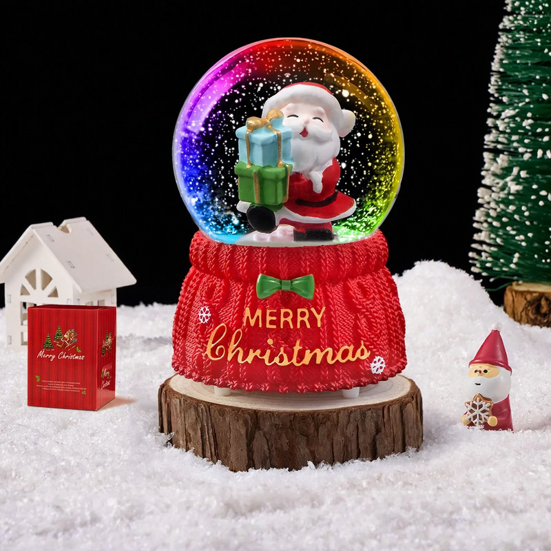Christmas snow globe with music box and carriage design