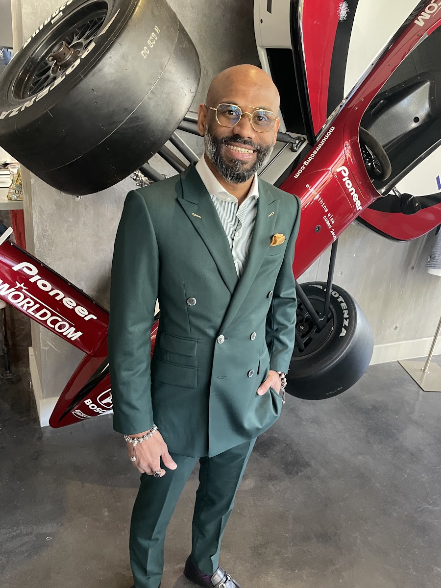 Bespoke By CB tailor examining premium wool and linen suit fabrics