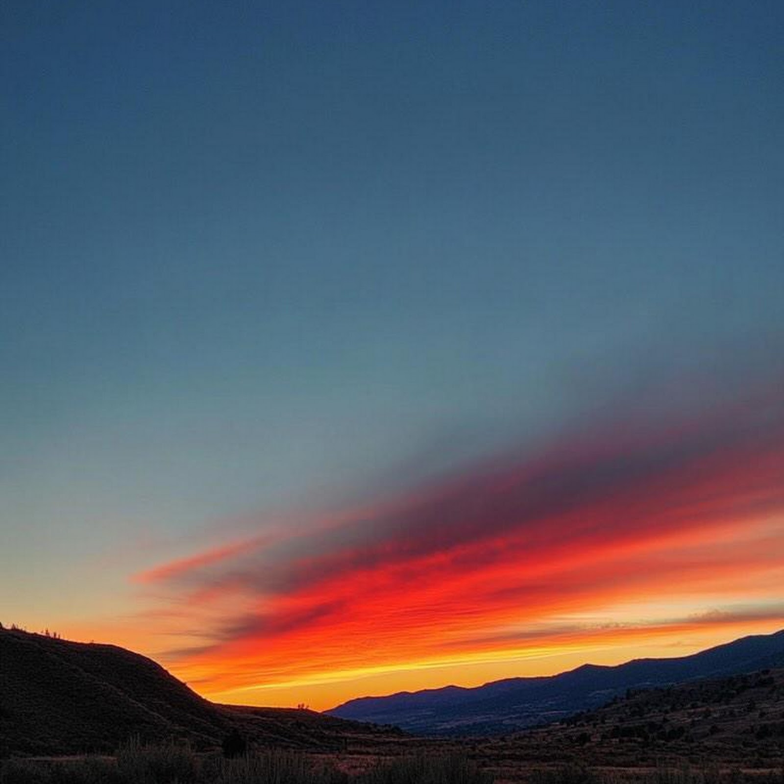 Download Sunset Over Mountain Grasslands iPhone