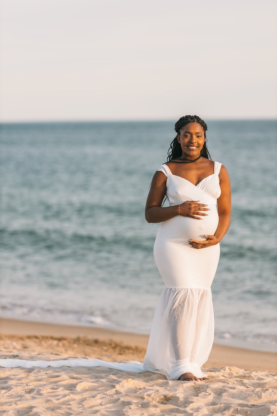 Expecting mother in flowing white on the beach — maternity photography Rhode Island