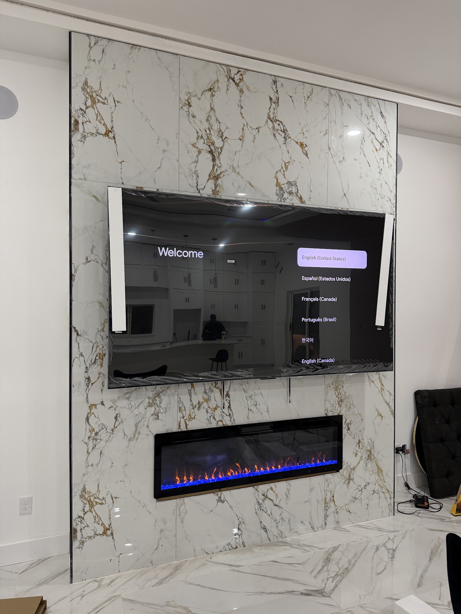 Refined materials and a dramatic marble fireplace feature.