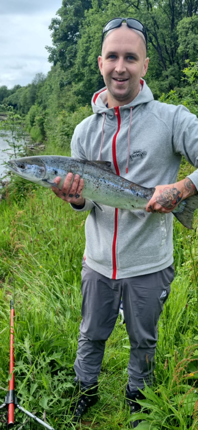 Michael McInnes with a Salmon caught on a Flying C lure on the River Leven