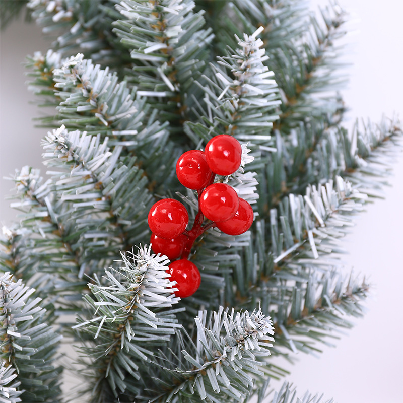 Christmas wreath with berries and pine cones