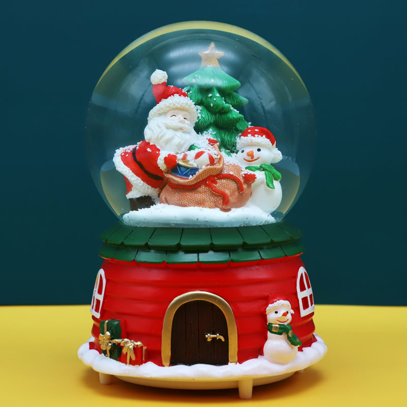 Weihnachtliche Schneekugel mit Musik und Licht