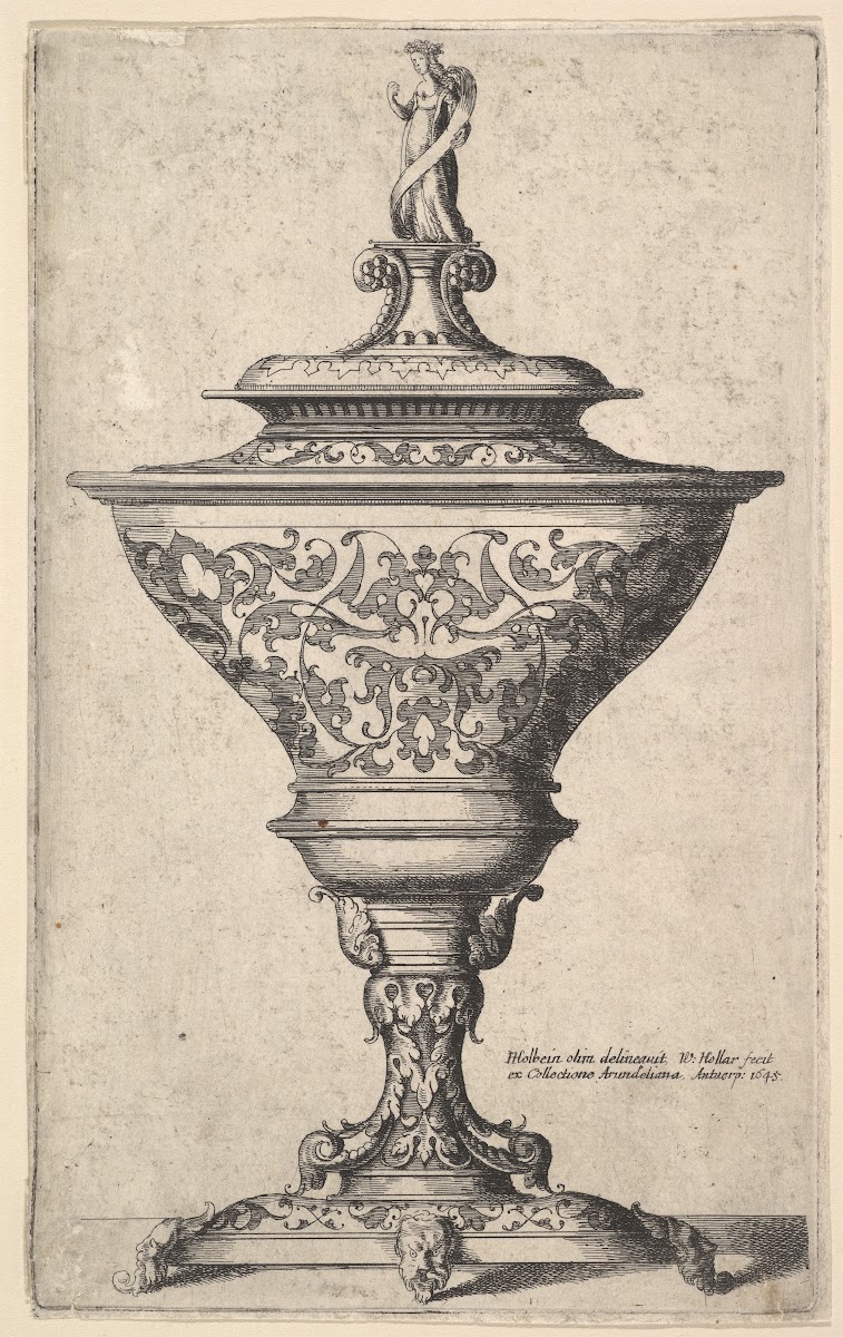 Ornate goblet on feet of masks 1645