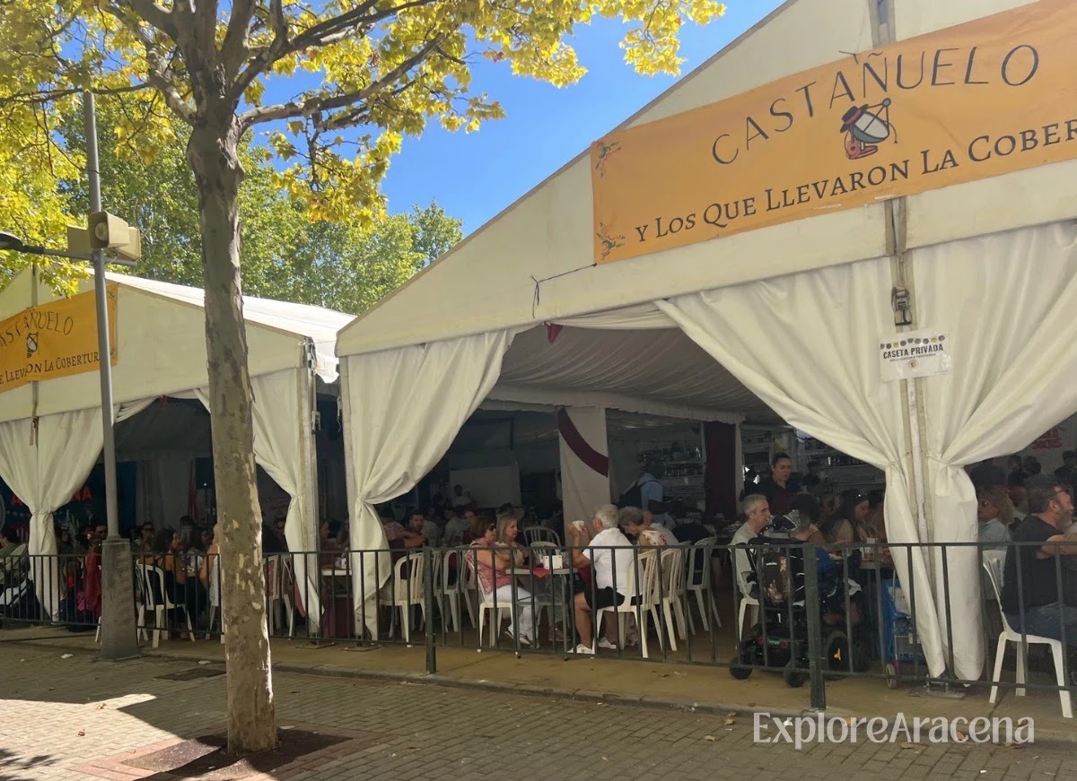 Busy casetas filled with visitors during the daytime Feria de Aracena celebrations.