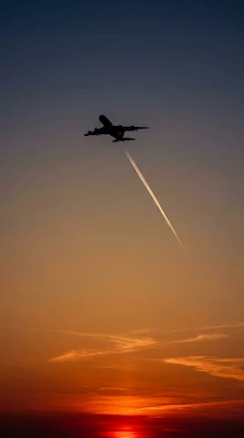 Airplane Contrail at Fiery Sunset