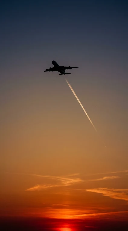 Airplane Contrail at Fiery Sunset