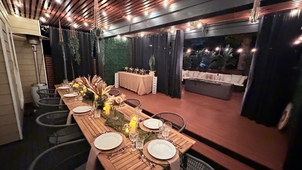 Evening celebration table with yellow florals on the patio
