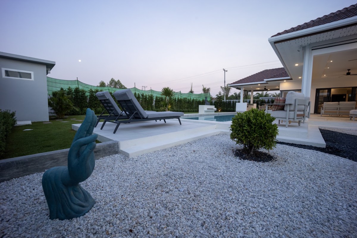 Private swimming pool and landscaped garden at Orchid Palm Homes