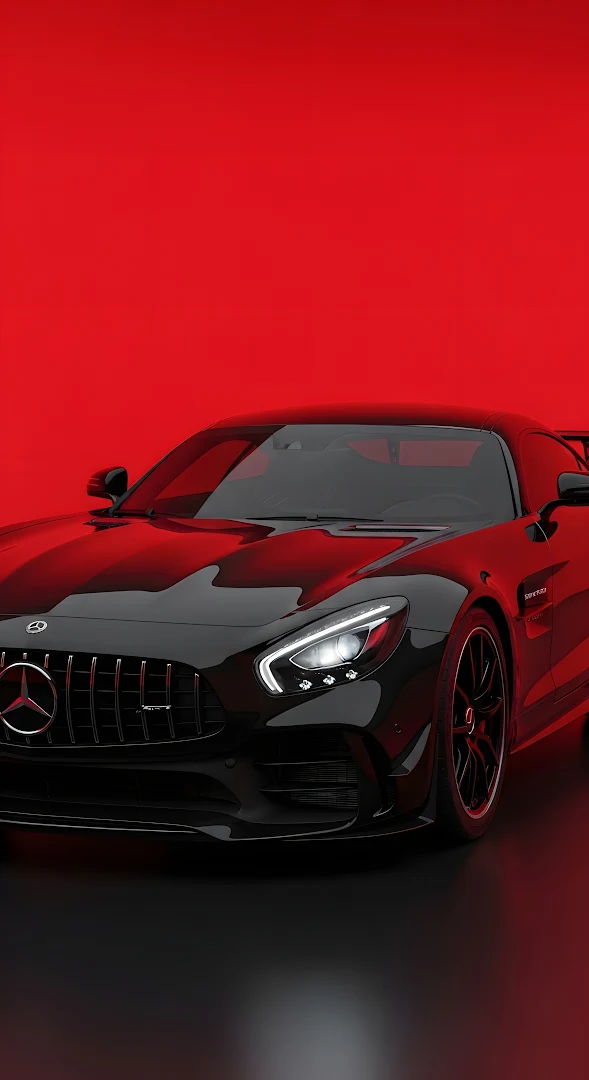 Black Mercedes AMG GT Sports Car Against Vibrant Red Background