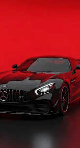 Black Mercedes AMG GT Sports Car Against Vibrant Red Background