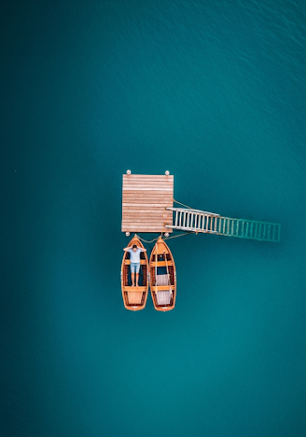 Man Relaxing in Rowboat Aerial View