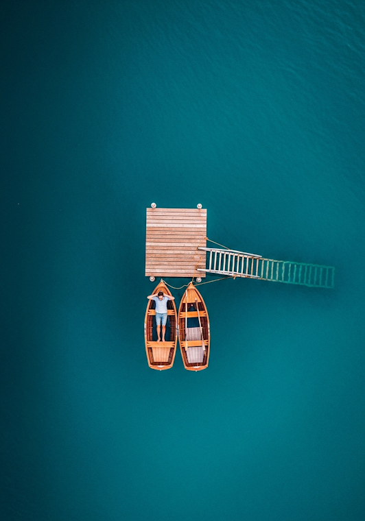 Man Relaxing in Rowboat Aerial View