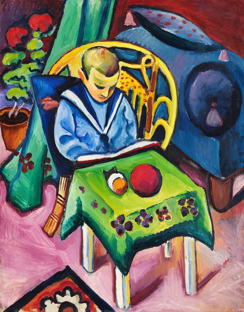 Junge mit Buch und Spielsachen 1912