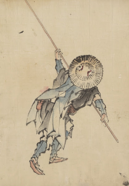 Rear view of a man full length standing wearing several layers of clothing and a