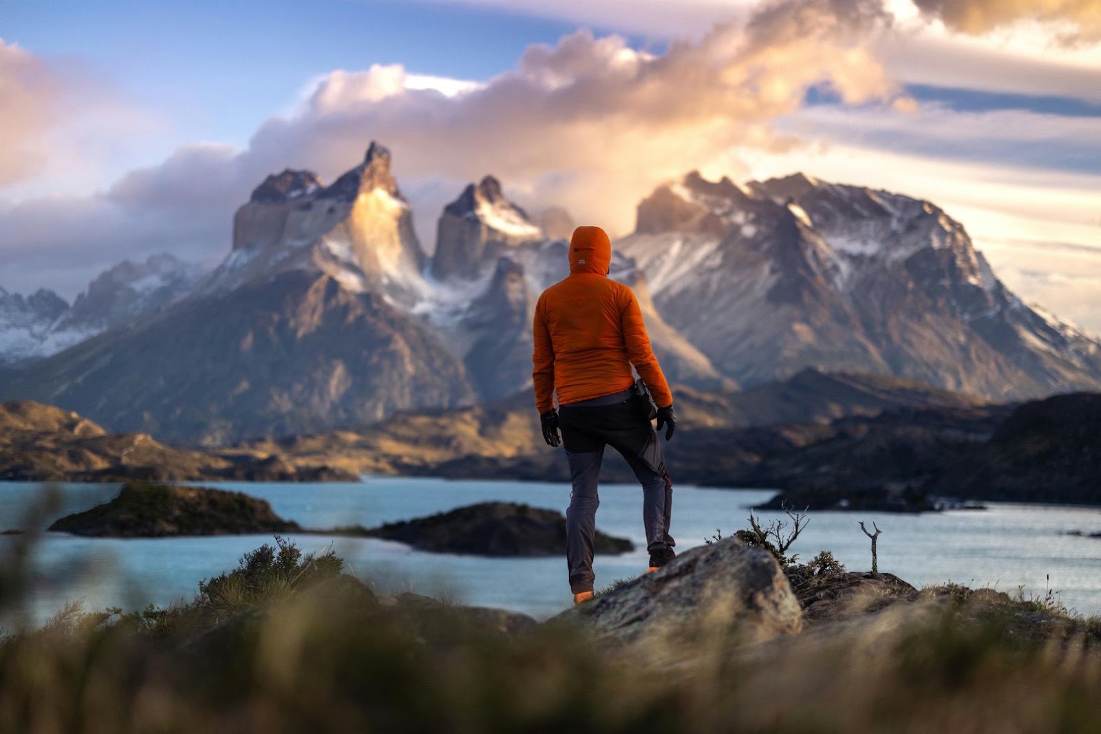 Dramatic granite peaks, blue water and rugged wilderness in Torres del Paine National Park in Chilean Patagonia.