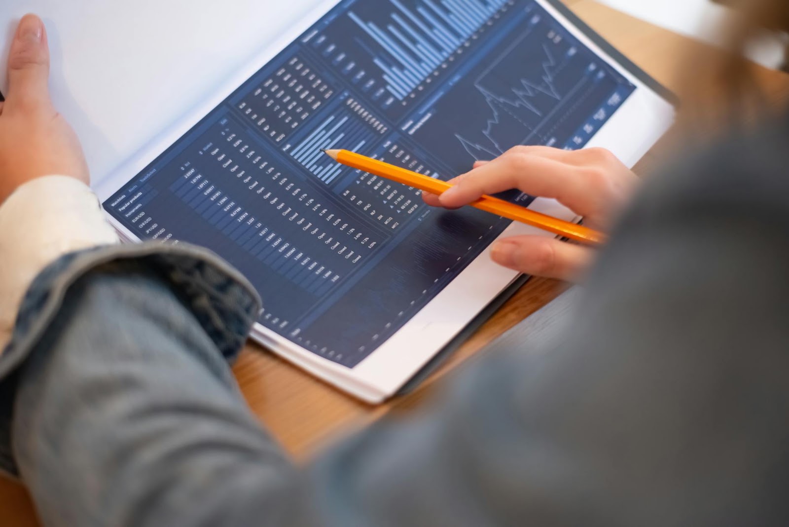 A business professional meticulously analyzing complex data charts and graphs, representing informed decision-making in the context of AI Market Reality.