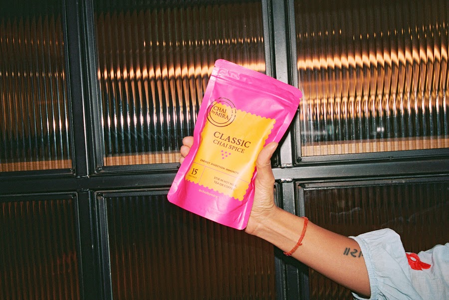 Holding the Classic Chai pouch