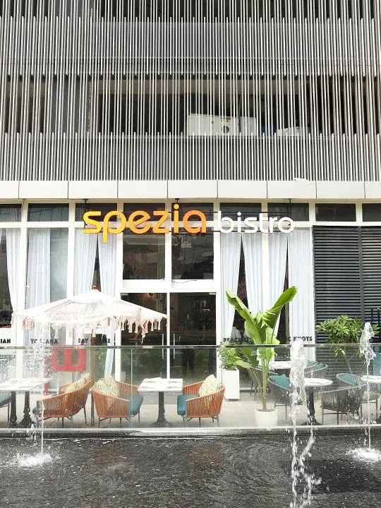 Spezia Bistro exterior facade with fountain at Magnum Global Park