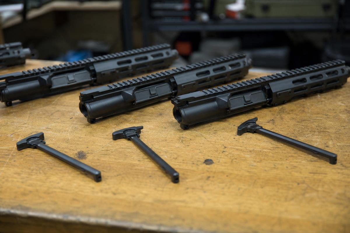 suppressed AR-15 charging handle and upper configuration comparison