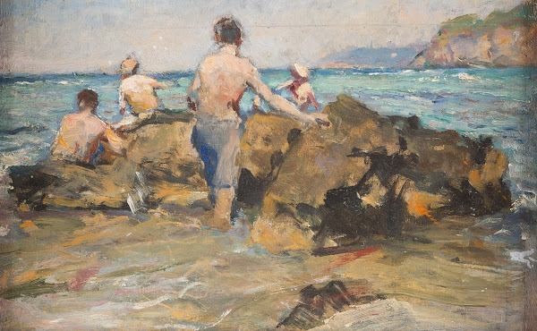 Boys at a rocky beach