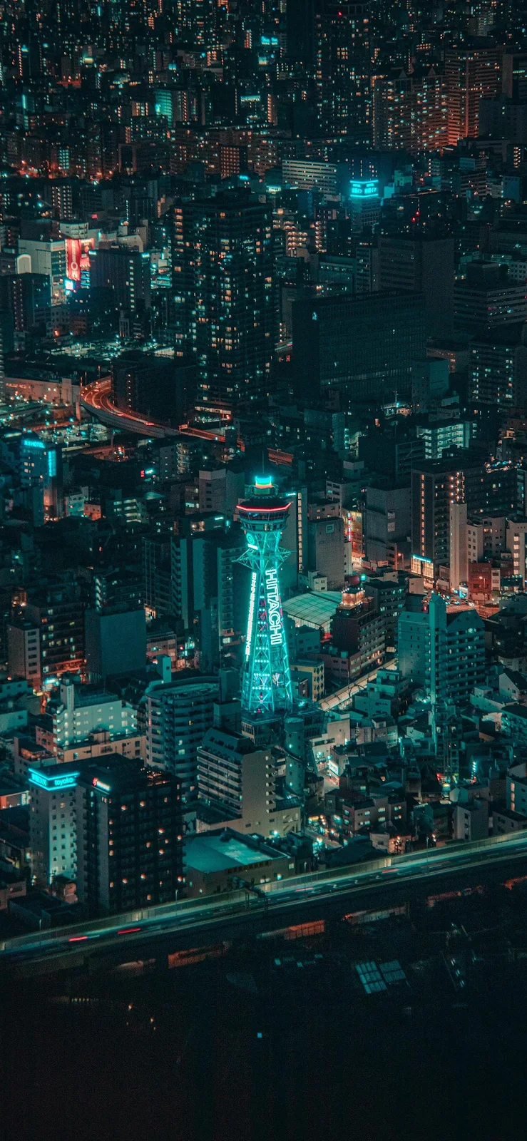 Neon Cyan Glow Over City Nightscape - Urban Nightscape Full HD iPhone Wallpaper (1377x2983)