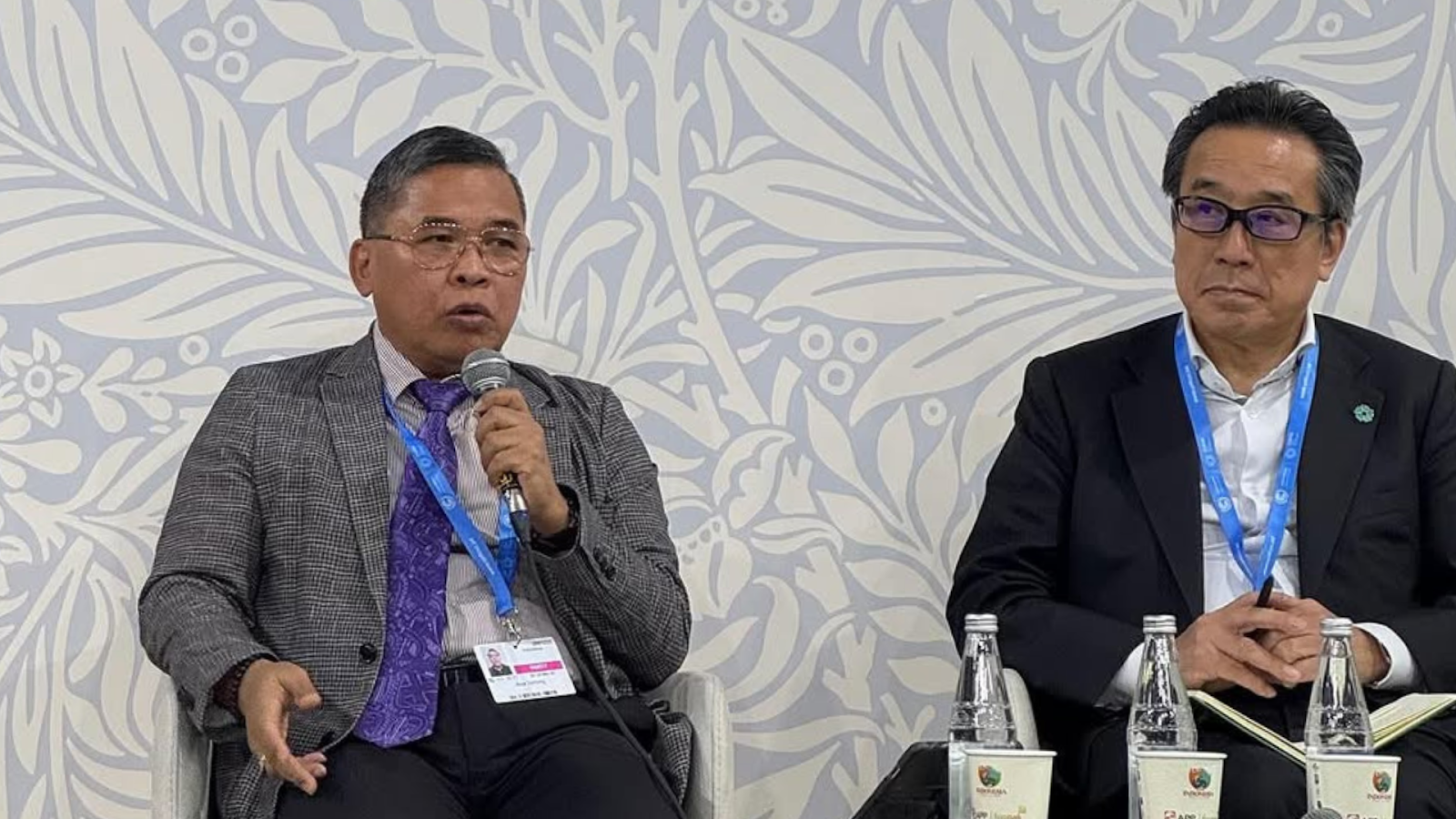 Alue Dohong speaking at Indonesian Pavilion COP29 with Yutaka Matsuzawa