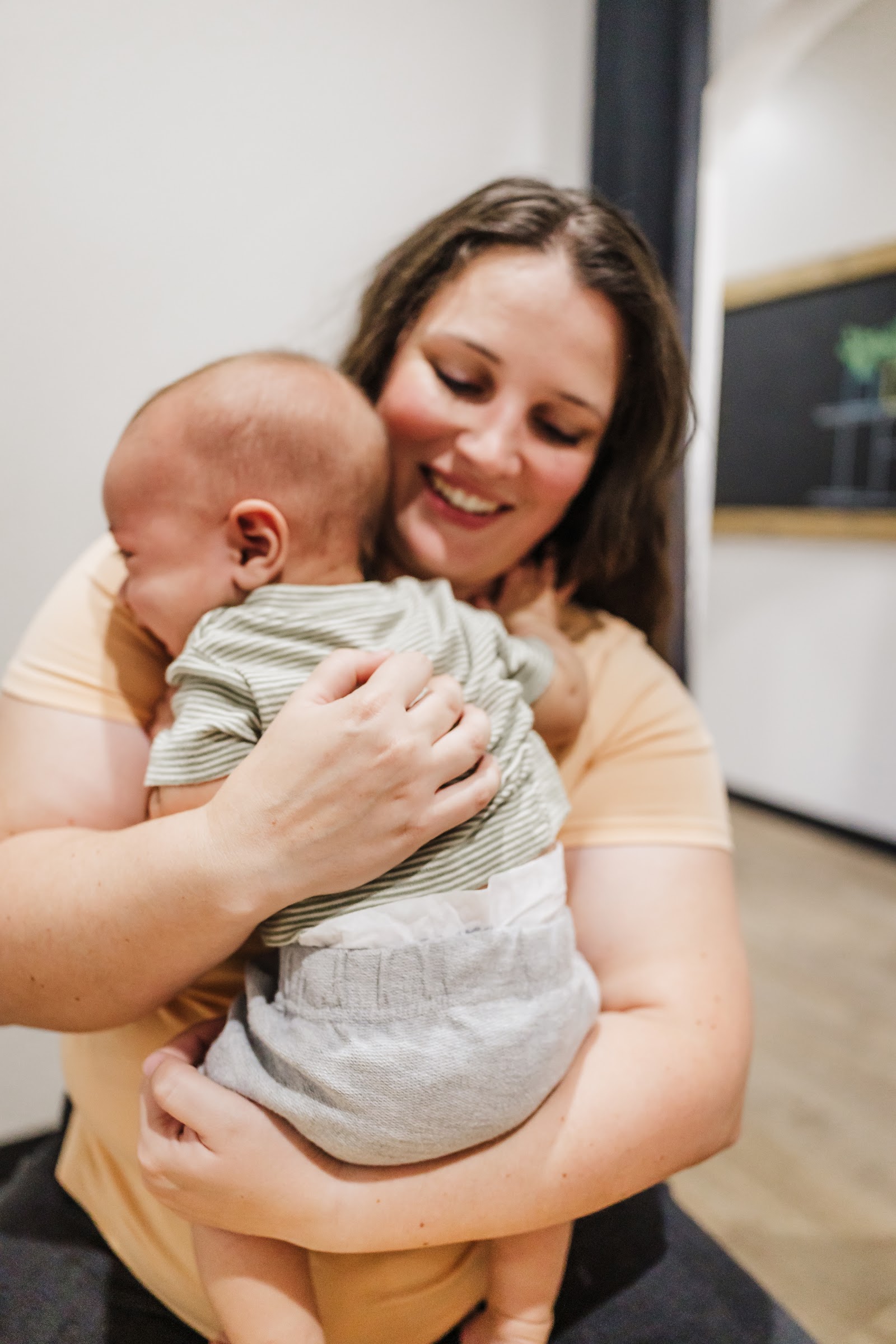 Ignite Family chiropractic team caring for a mom and her baby