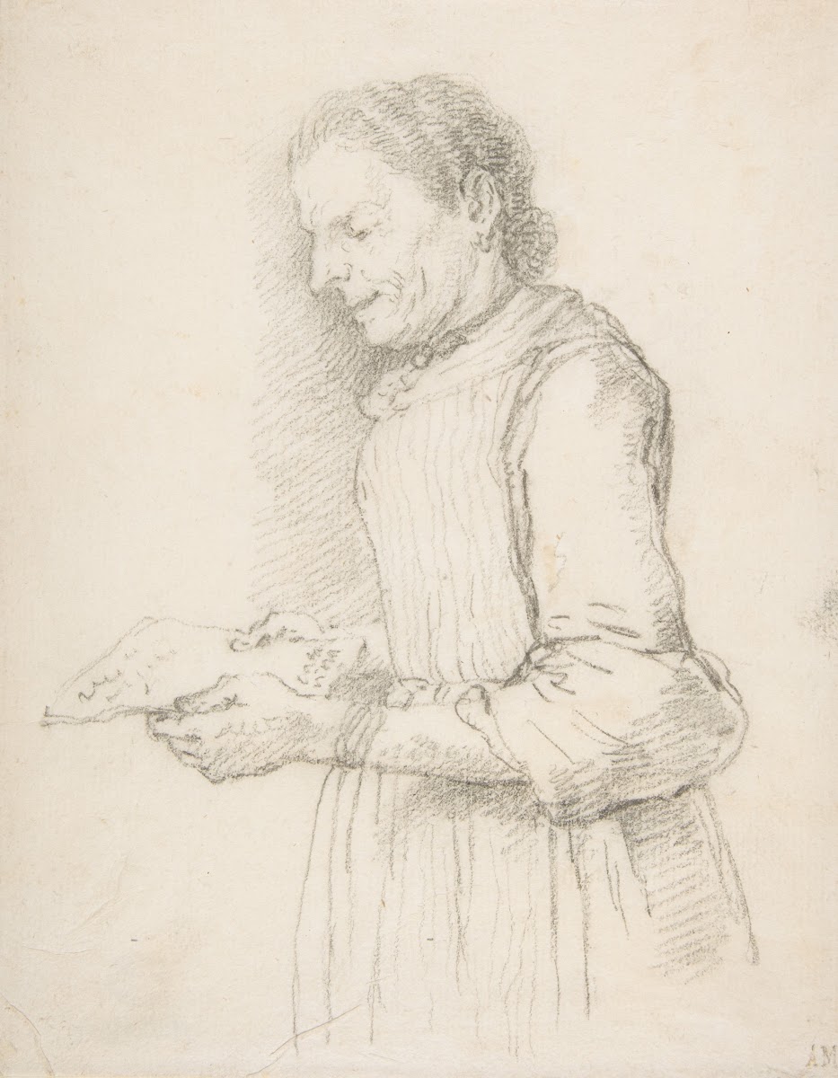 Woman in Half Length Profile View Facing Left and Reading a Piece of Paper Signe