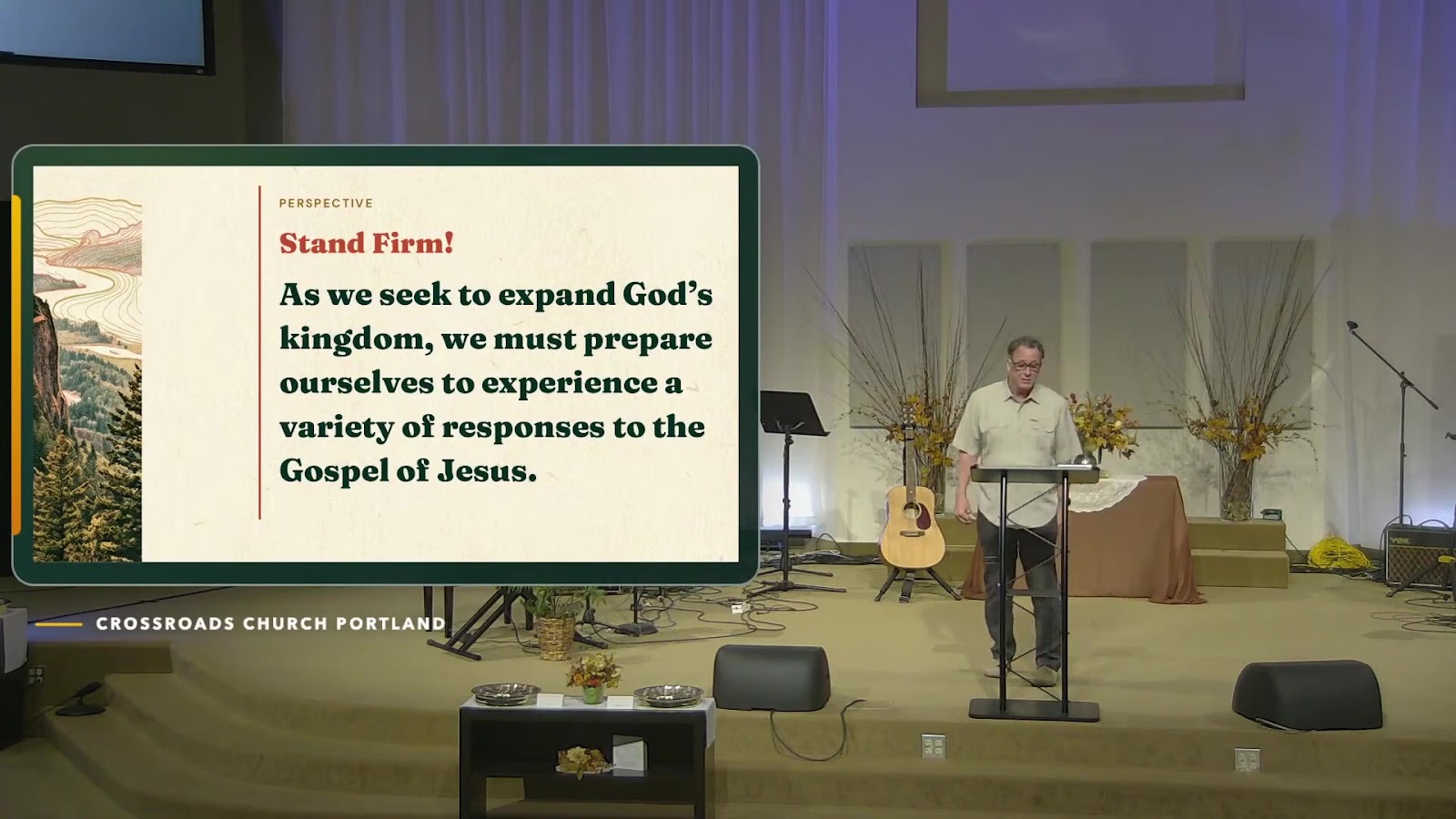 Speaker teaching during the September 6 service beside the Stand Firm message slide.