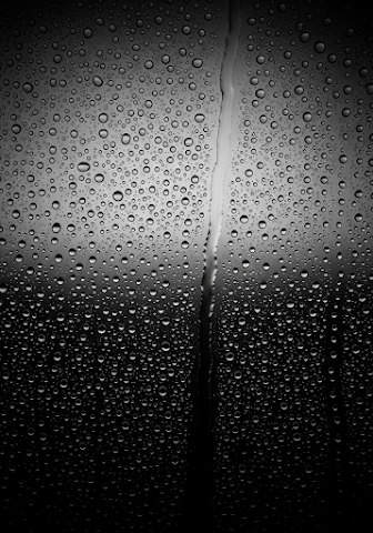 Monochrome Rain on Glass Window