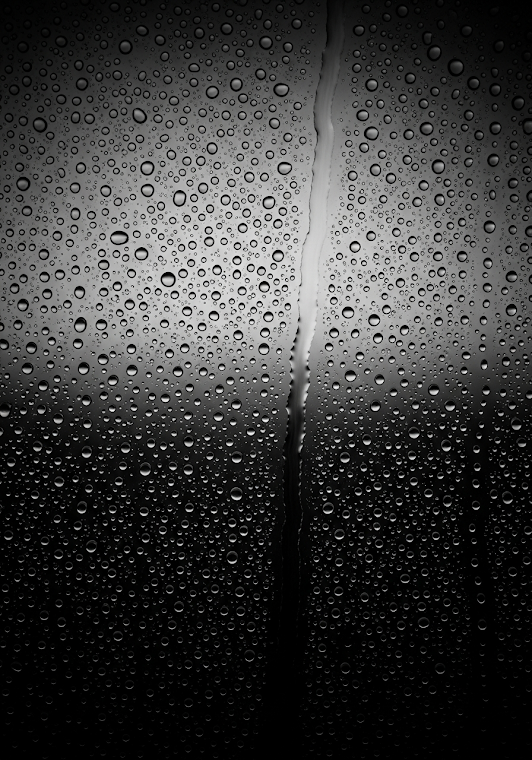 Monochrome Rain on Glass Window