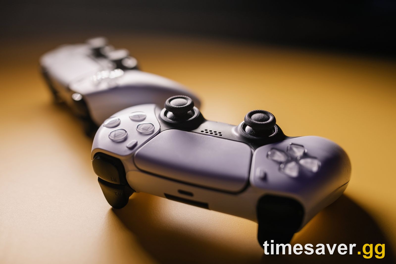 Two modern game controllers, the kind you connect to a PC for Fortnite