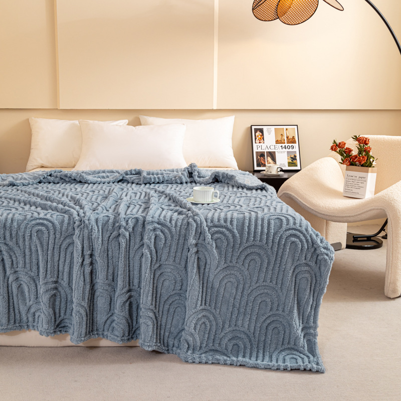 Padded throw blanket with jacquard pattern