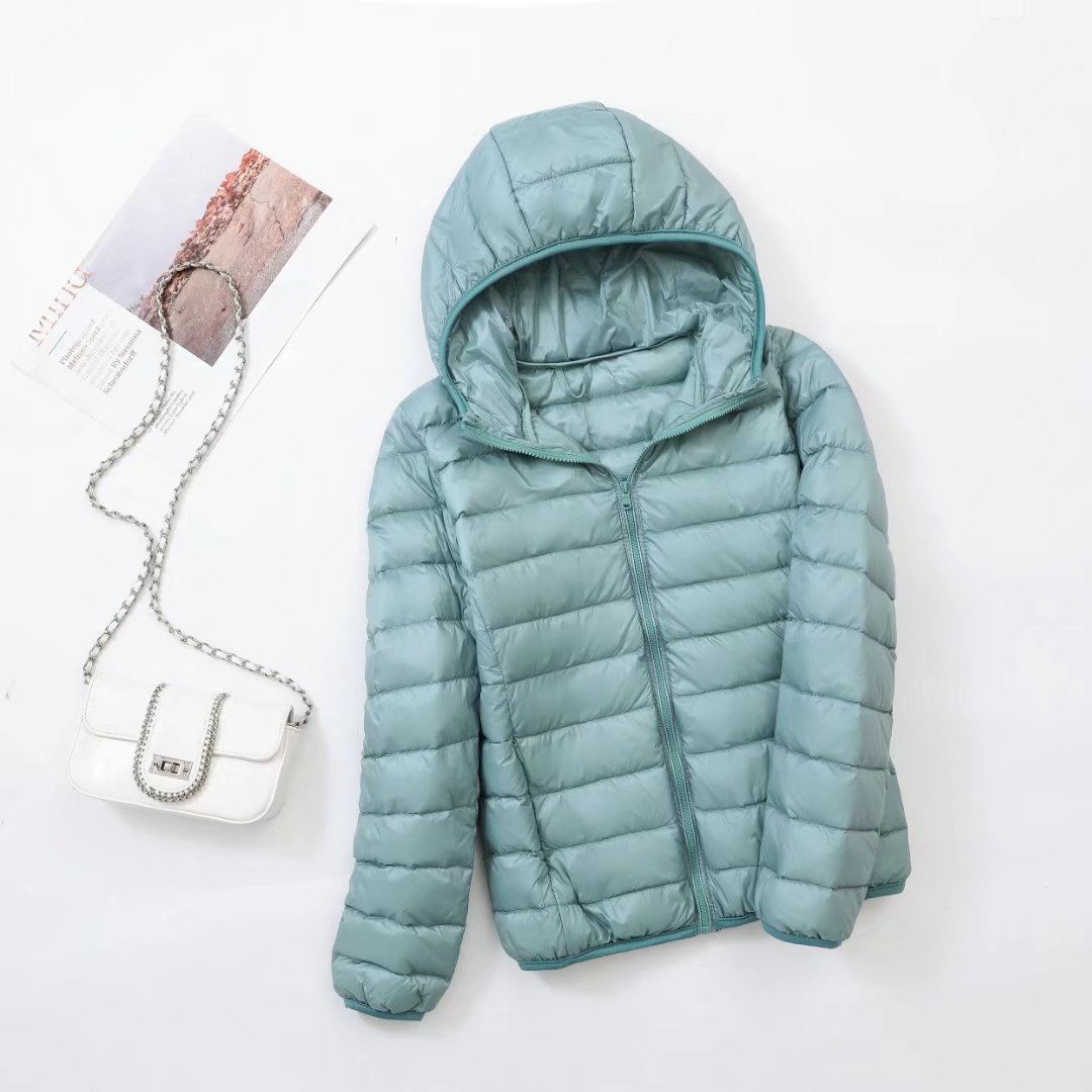 Lightweight women's down jacket with a hood, slim fit