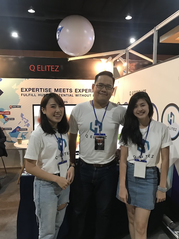 With the Q Elitez team at an expo booth