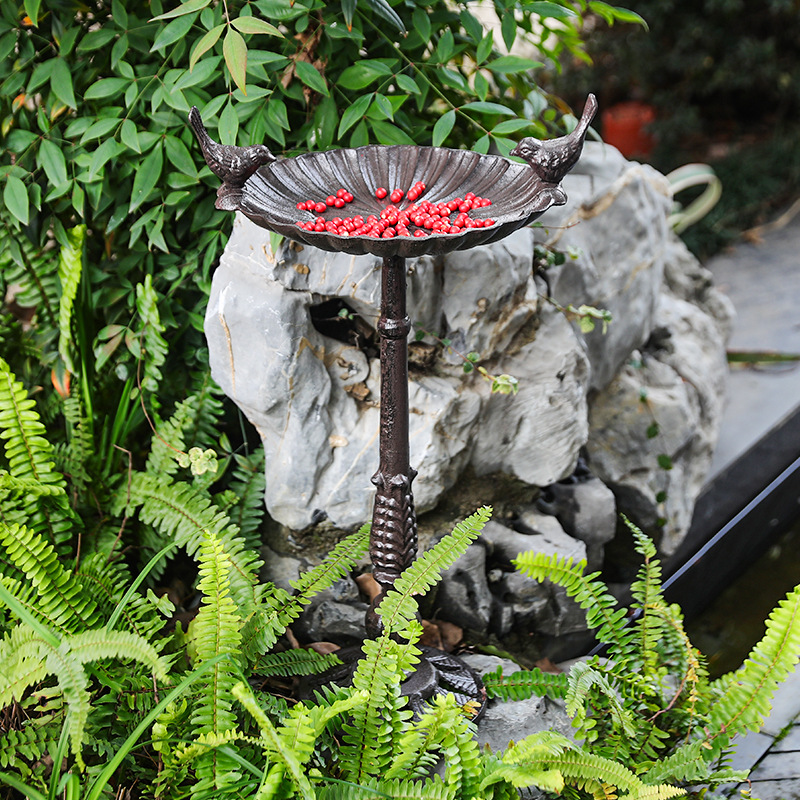 Antique cast iron birdbath on stand