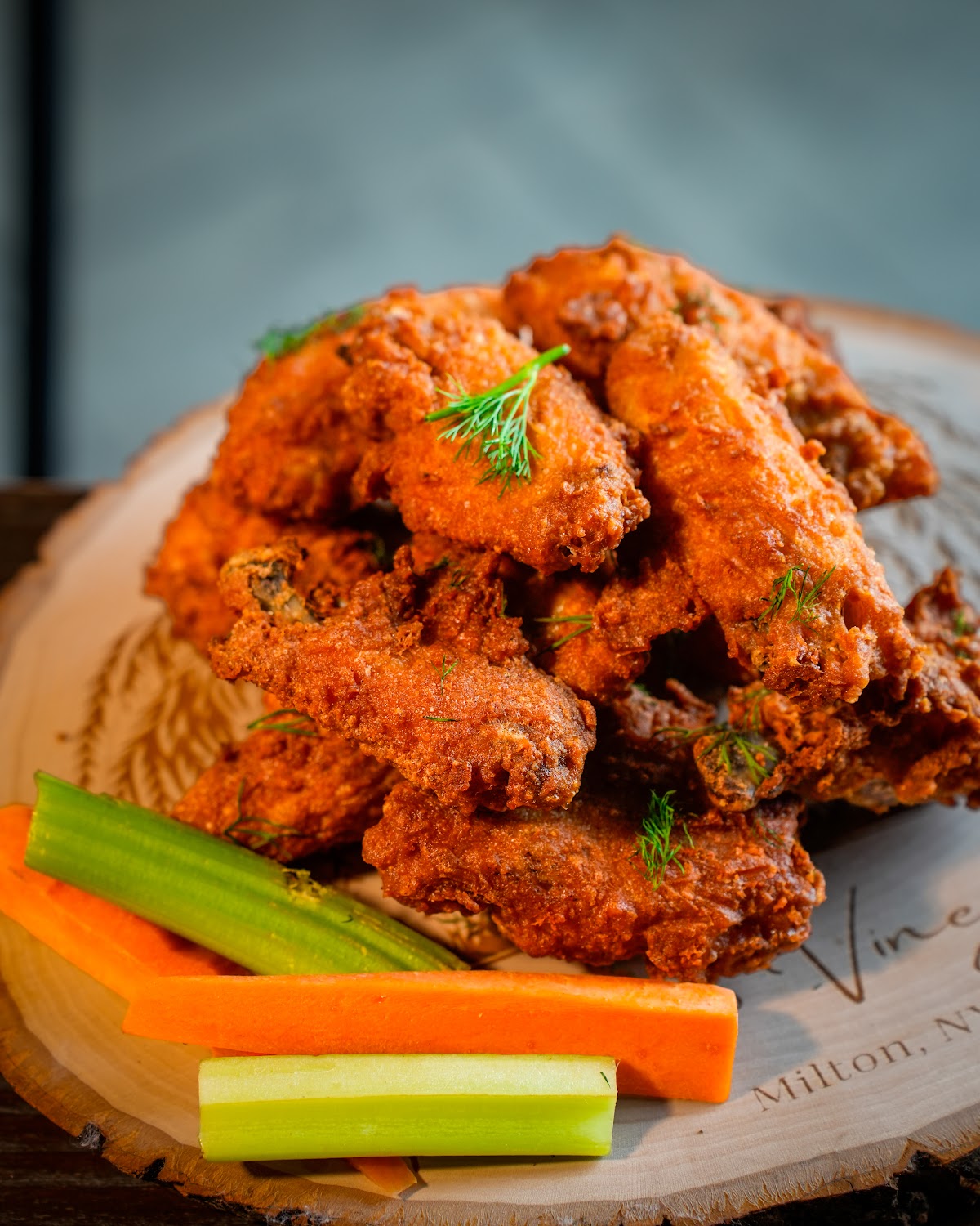 Crispy chicken wings with celery — restaurant photography Hudson Valley