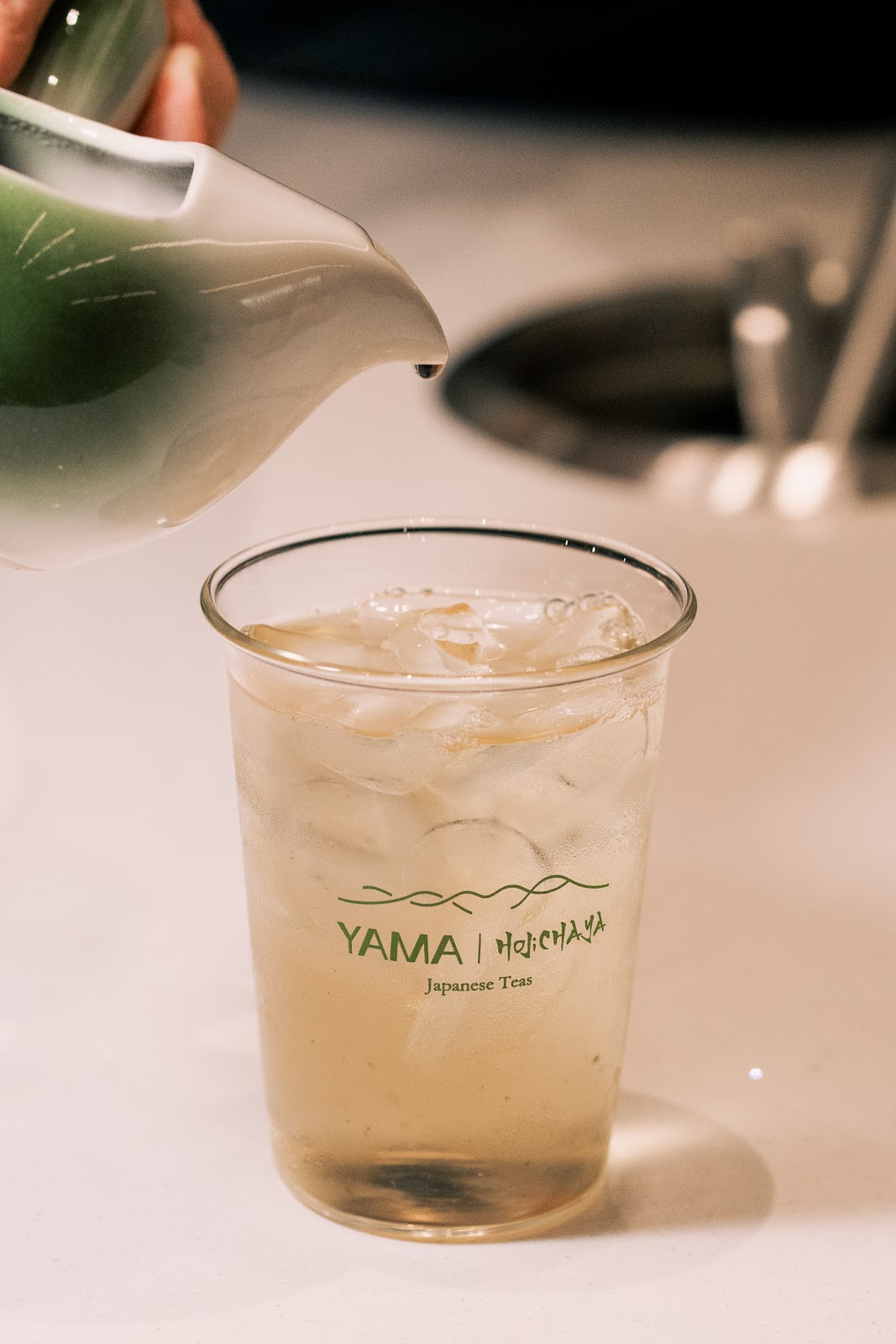 Matcha latte being poured