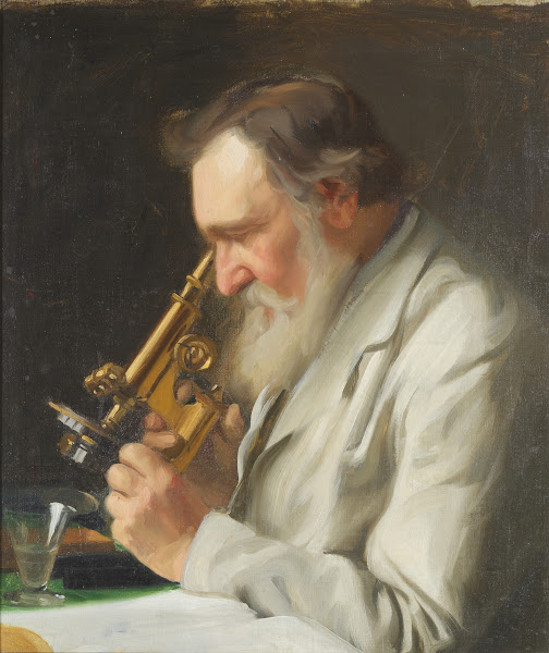 Alex Niskov with a microscope
