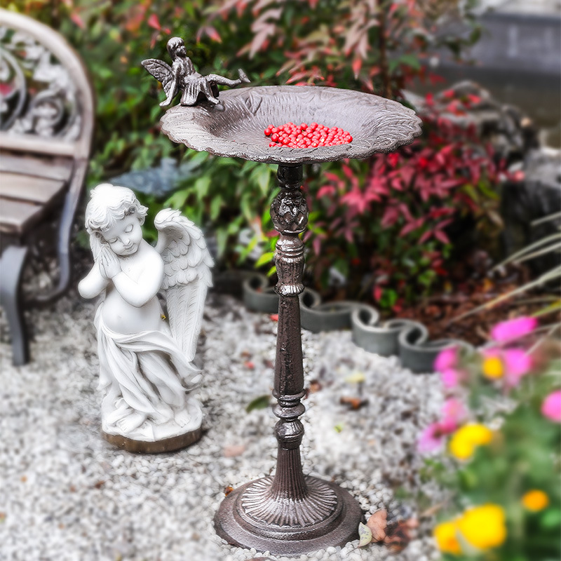 Standing metal birdbath in vintage style