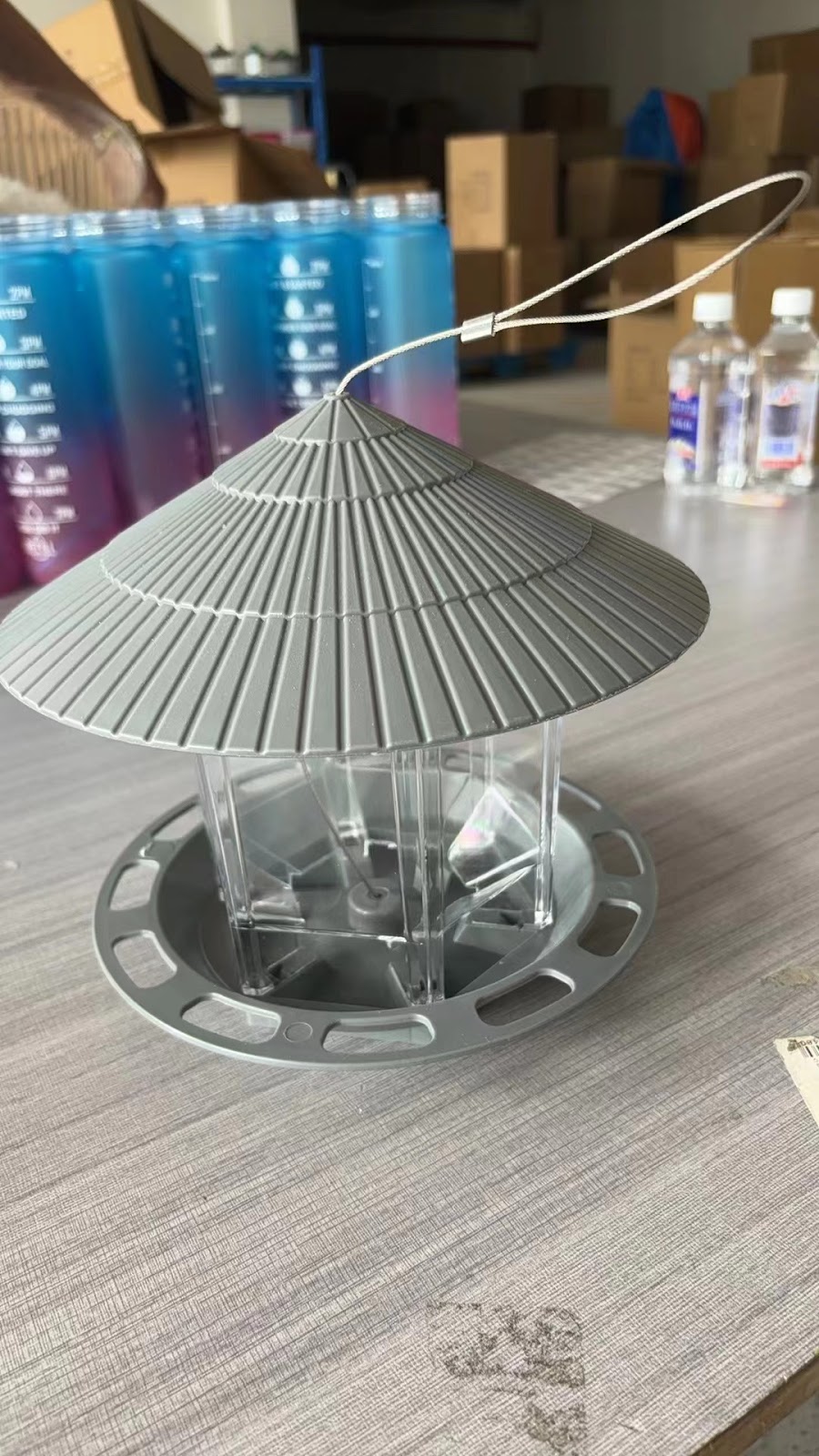 Hanging bird feeder for outdoor use