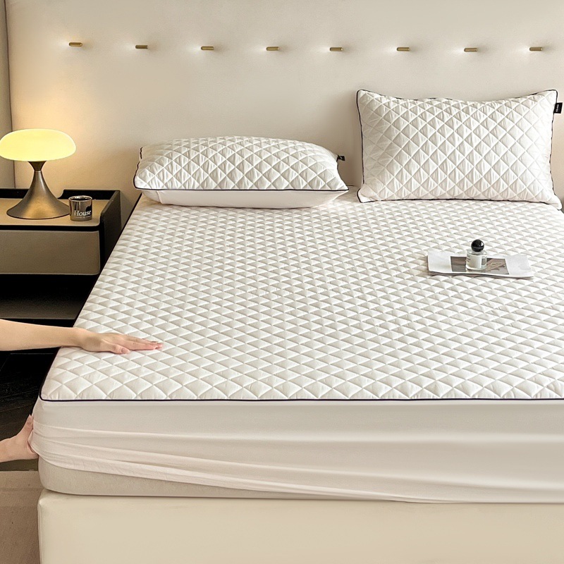 Quilted fitted cover with slip protection