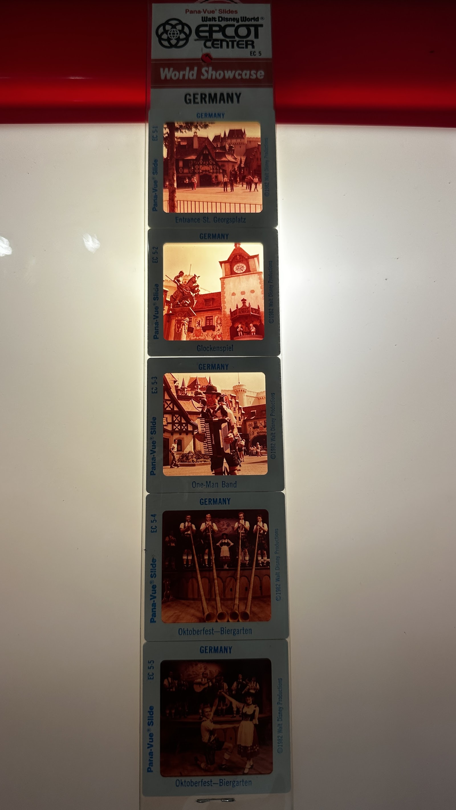 Original 1982 photographic slides of the EPCOT Center World Showcase Germany Pavilion, set EC 5, showing the Bavarian-style architecture and cobblestone plaza in the park's opening year