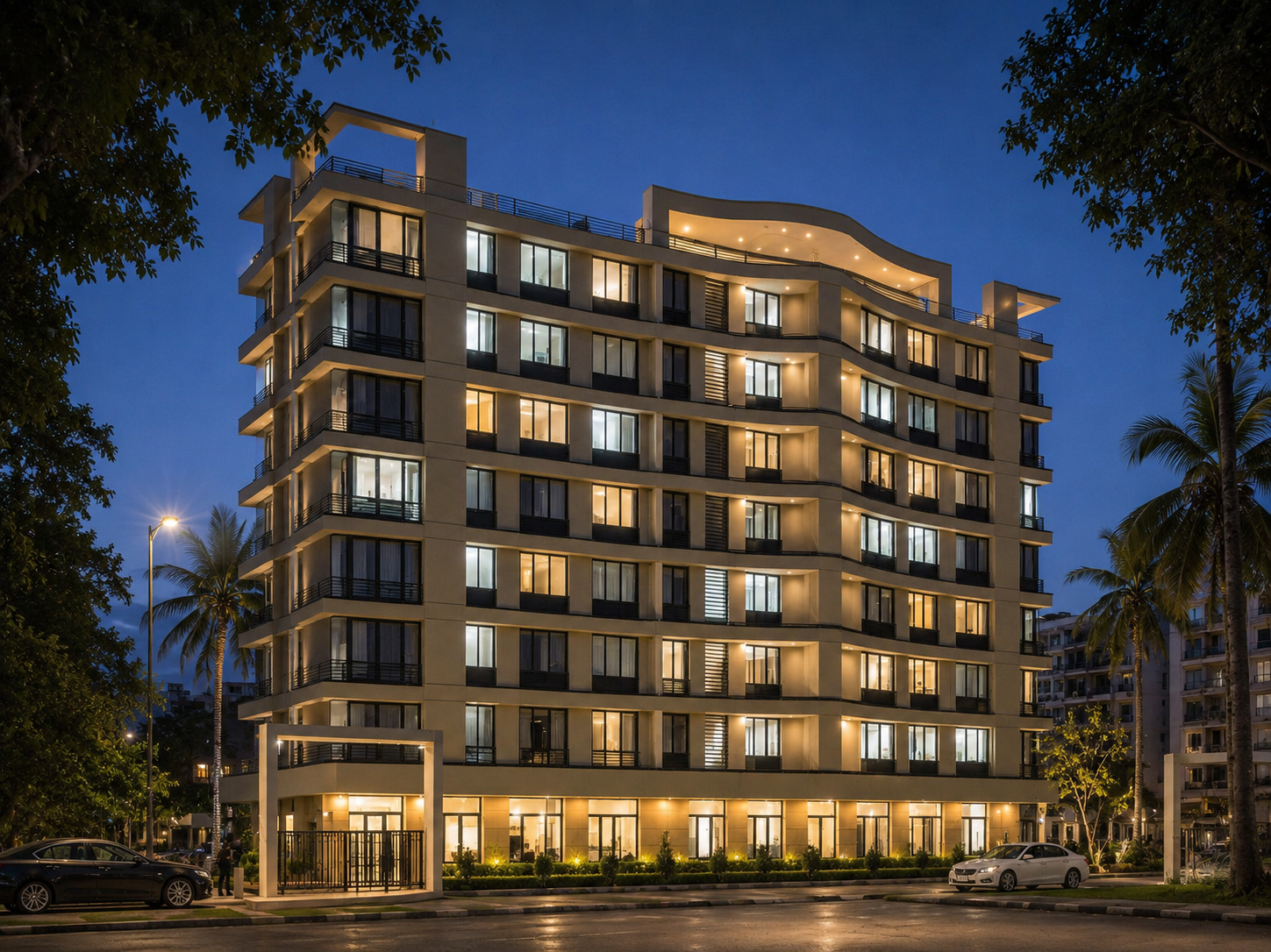 Curved mid-rise residential building at dusk